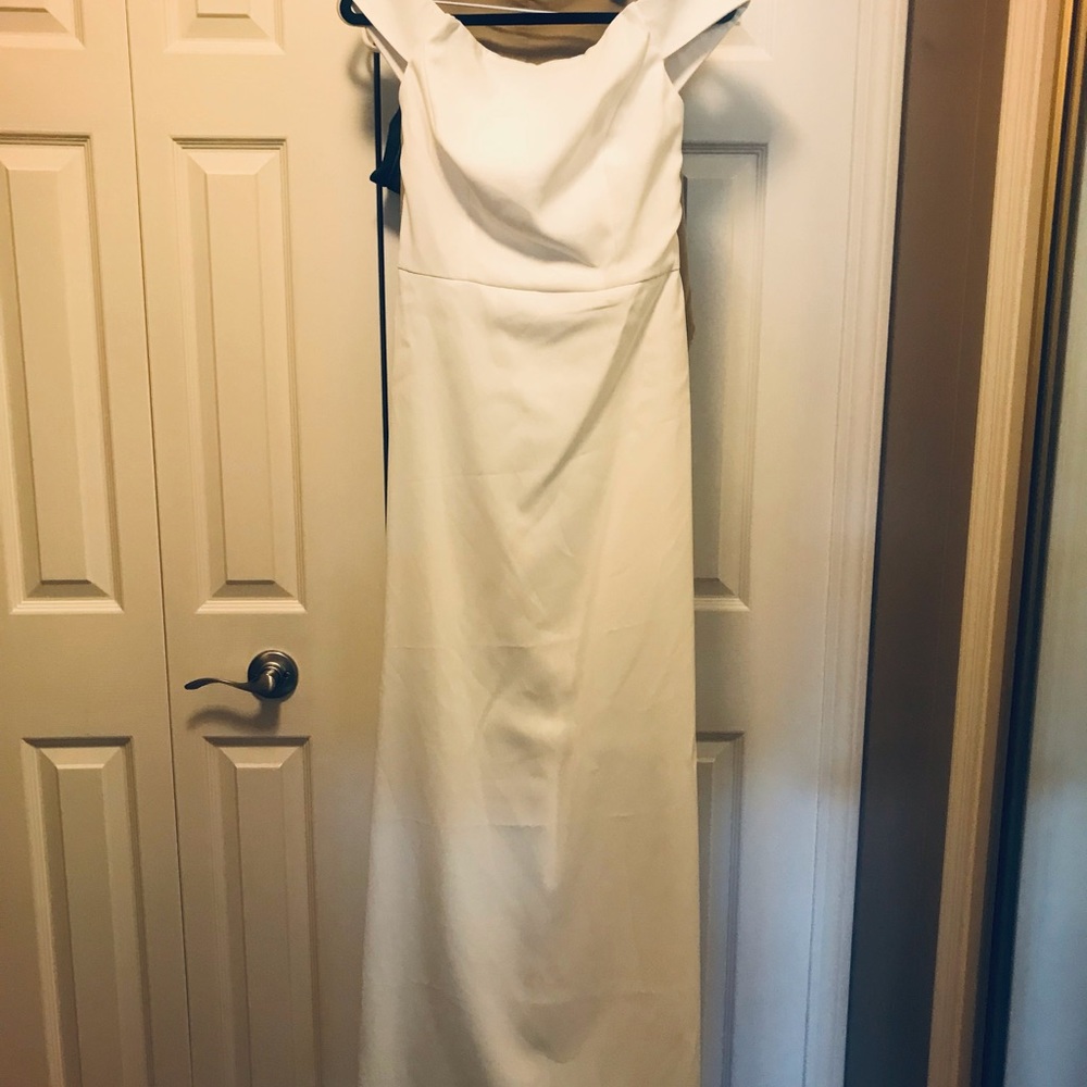Ivory off the shoulder wedding dress.